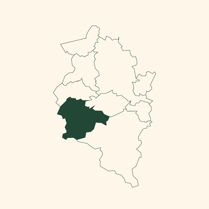 Das Bild zeigt eine Karte mit mehreren Umrissen, wobei ein Bereich im Südwesten farblich hervorgehoben ist. Dieser Bereich ist in dunklem Grün dargestellt, während die restlichen Umrisse in einem helleren Farbton gehalten sind.