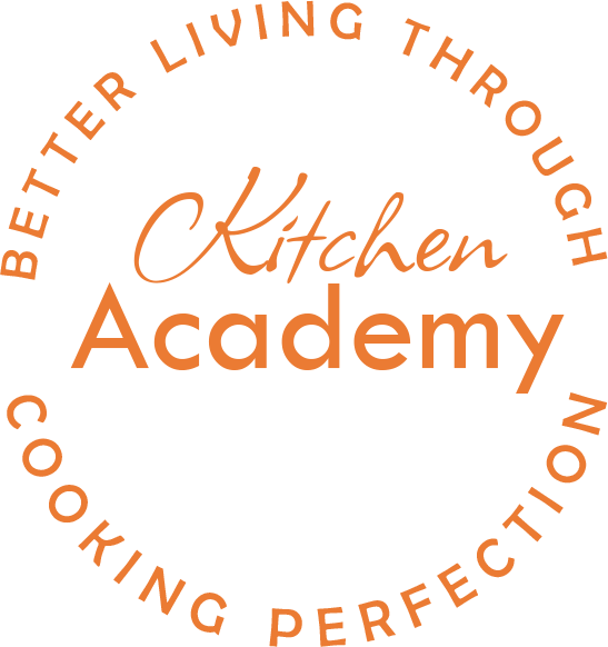 Logo der Kitchen Academy mit dem Slogan „Besser leben durch Koch perfektion“. Der Schriftzug ist kreisförmig angeordnet, wobei „Kitchen“ und „Academy“ hervorgehoben sind.