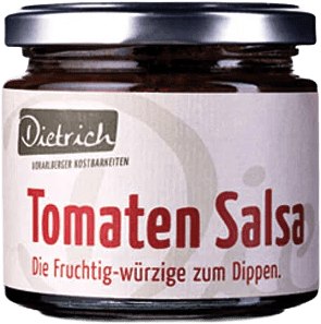 Ein Glas Tomatensalsa mit dem Aufdruck "Dietrich" und dem Slogan "Die Fruchtig-würzige zum Dippen". Die Verpackung ist dunkel und hat eine klare, einfache Gestaltung.