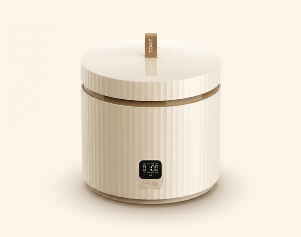 Ein moderner elektrischer Waxing-Behälter in hellem Beige mit einer ribbeligen Oberfläche. Er hat einen Deckel mit einem Griff und ein digitales Steuerfeld an der Vorderseite zur Temperatureinstellung. Der gesamte Look ist schlicht und elegant, ideal für die Anwendung zu Hause.